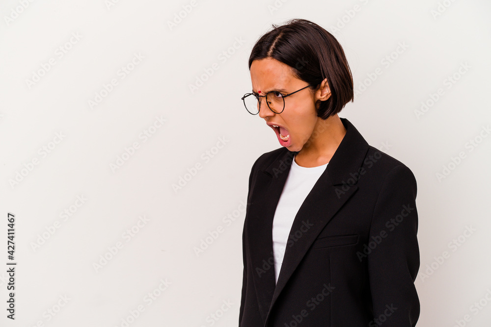 Young business Indian woman isolated on white background shouting towards a copy space Young business Indian woman isolated on white background shouting towards a copy space
