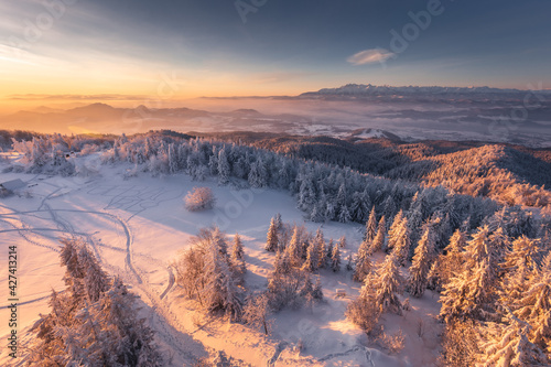 Winter morning in Gorce on the tower on the top of Luban. A beautiful, romantic atmosphere with a view of the Pieniny Mountains, the Beskids and the Tatra Mountains.