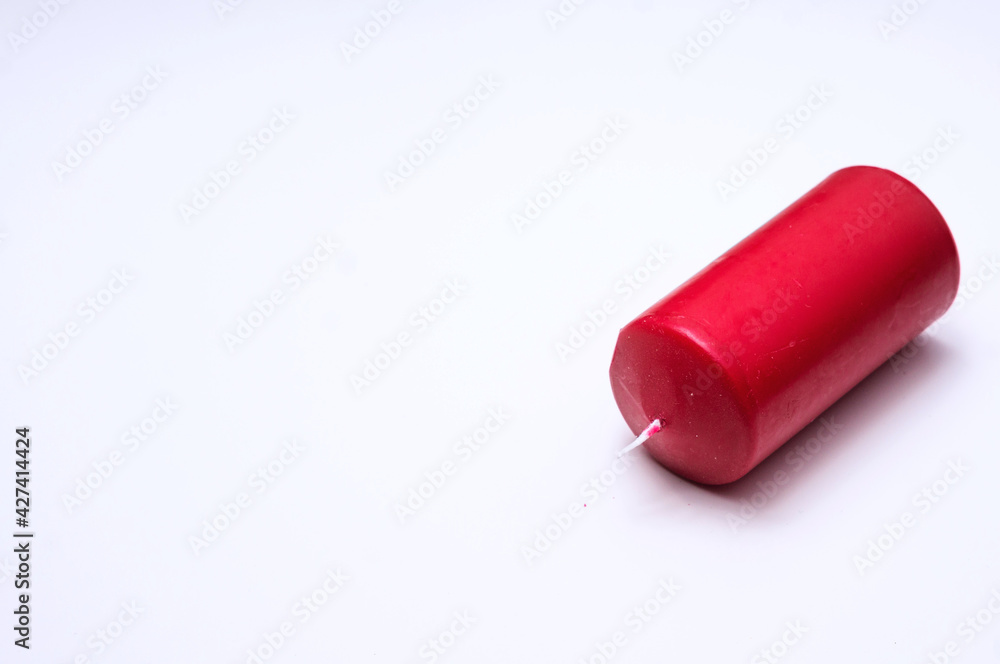 Big red candle isolated on white background Big red candle isolated on white background