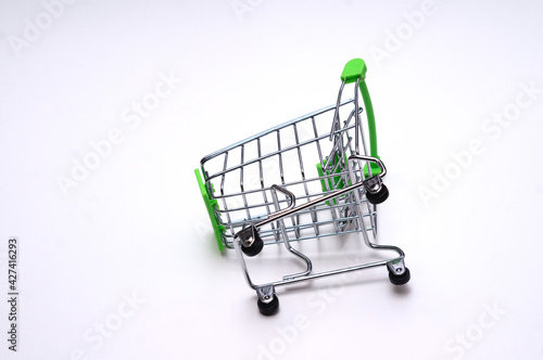 Toy shopping cart isolated on white background