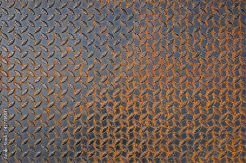 Pattern of old metal diamond plate, Surface of black steel floor non-skid with rusted, Texture background