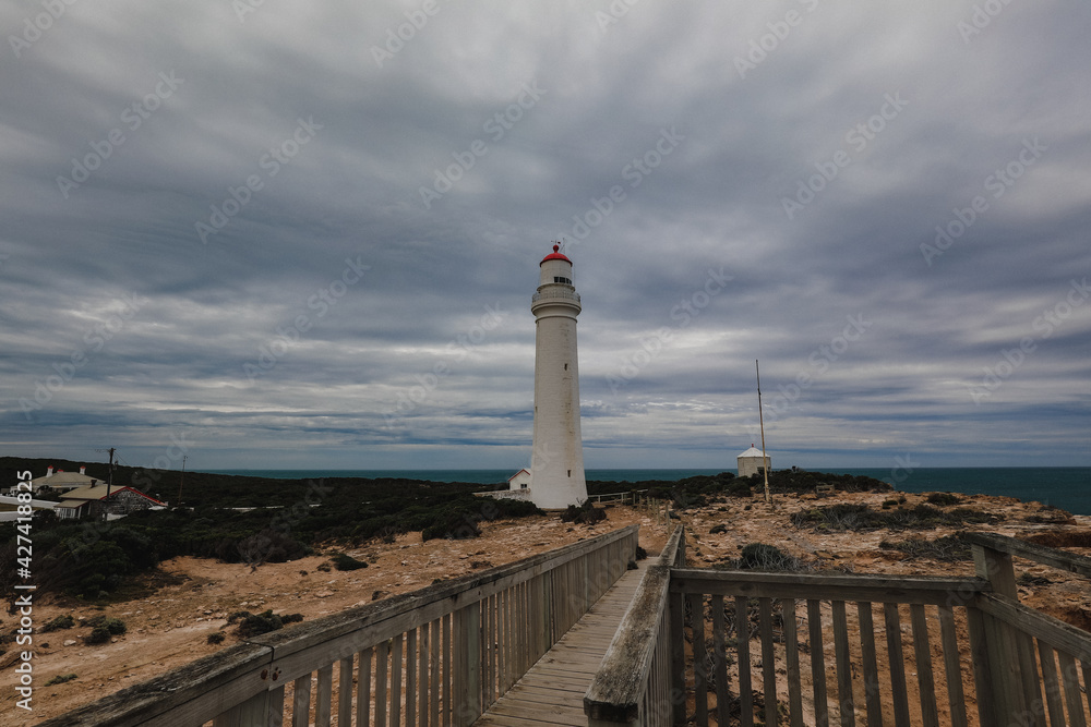 Magestic historical Cape Nelson lighthouse on overcast day at Portland, Victoria Australia