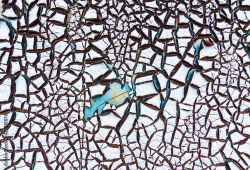 Abstract background of textured blue cracked wall.