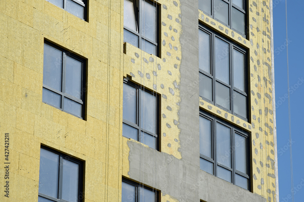 Fototapeta premium Thermal insulation of an apartment building and plastering of walls.
