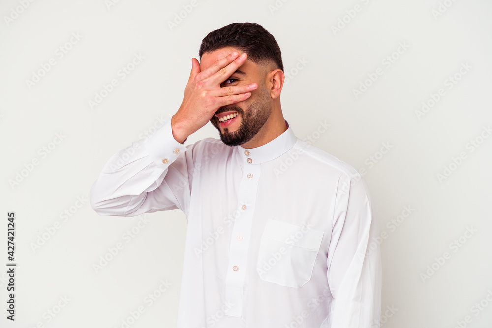 Young arab man wearing typical arab clothes isolated on white background Young arab man wearing typical arab clothes isolated on white background