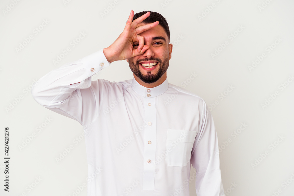 Young arab man wearing typical arab clothes isolated on white background Young arab man wearing typical arab clothes isolated on white background
