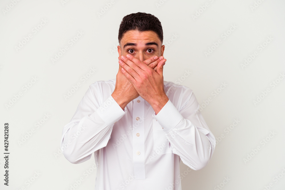 Young arab man wearing typical arab clothes isolated on white background Young arab man wearing typical arab clothes isolated on white background