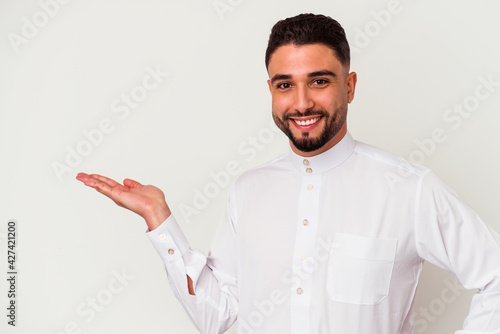 Young arab man wearing typical arab clothes isolated on white background