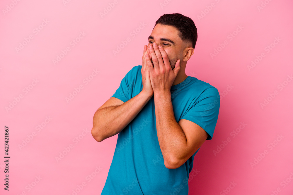 Young mixed race man isolated on pink background Young mixed race man isolated on pink background