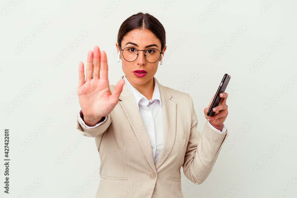 Young business woman holding a mobile phone isolated on white background Young business woman holding a mobile phone isolated on white background