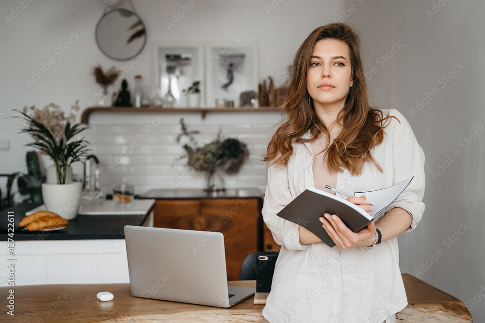 Emotional young woman using her laptop at home Emotional young woman using her laptop at home