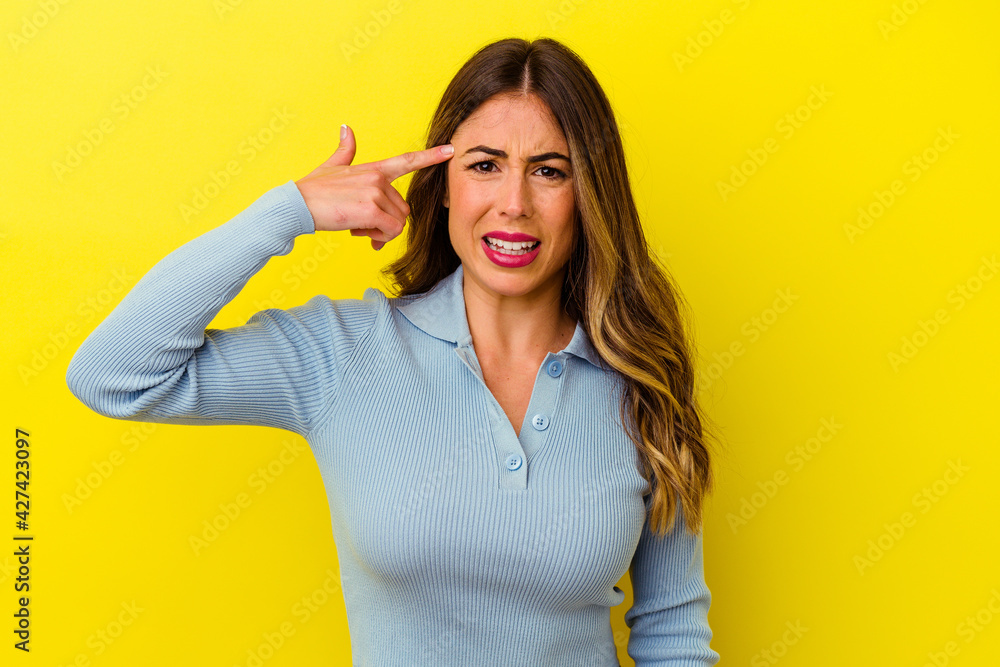 Young caucasian woman isolated on yellow background Young caucasian woman isolated on yellow background