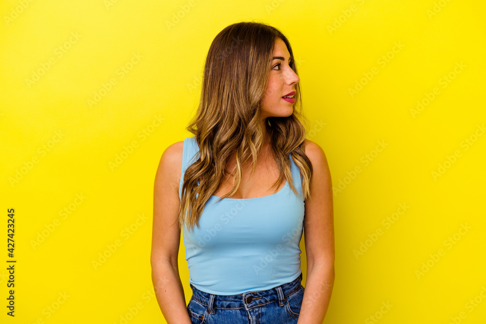Young caucasian woman isolated on yellow background Young caucasian woman isolated on yellow background