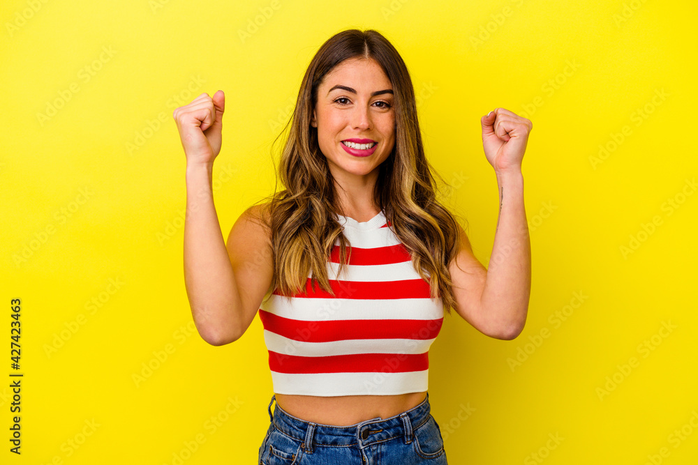 Young caucasian woman isolated on yellow background Young caucasian woman isolated on yellow background