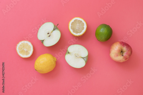 Seasonal natural fruits on pink background