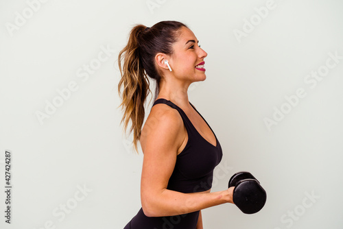 Young fitness woman with dumbbells isolated on white background