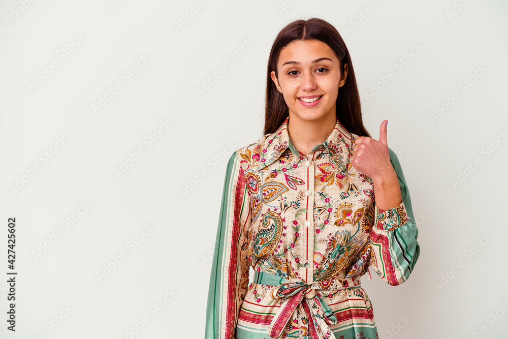 Young Indian woman isolated on white background smiling and raising thumb up Young Indian woman isolated on white background smiling and raising thumb up