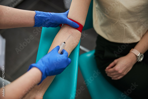 Phlebotomist drawing blood for a laboratory test