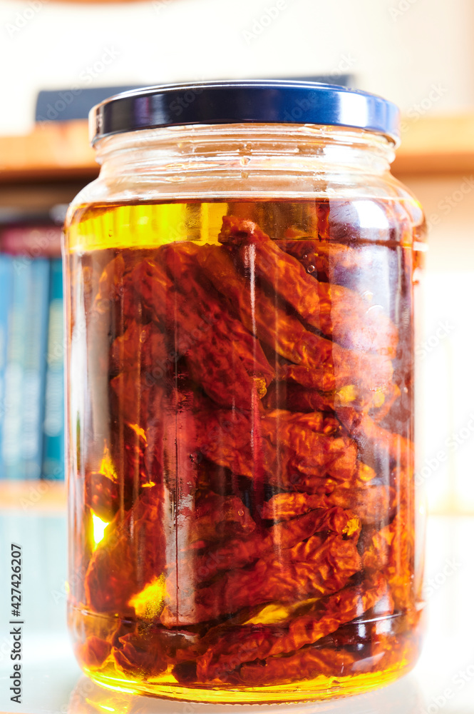 Sun dried tomatoes with olive oil in a jar Sun dried tomatoes with olive oil in a jar