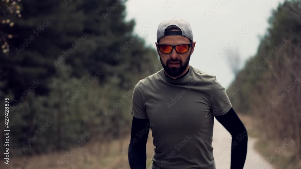 Running Man On Road Half Marathon.Triathlete Jogger Ready For Marathon And Hard Training Before Running Competition.Runner Man In Sportswear Preparing To Triathlon And Sprinting In Park On Fall. Running Man On Road Half Marathon.Triathlete Jogger Ready For Marathon And Hard Training Before Running Competition.Runner Man In Sportswear Preparing To Triathlon And Sprinting In Park On Fall.