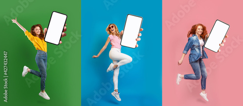 Creative collage with lovely young women jumping with empty smartphones on colorful studio backgrounds, mockup
