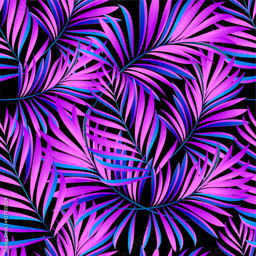 Palm trees. Neon color of tropical leaves. Trendy colorful palm leaf, jungle background and purple exotic plants. 
