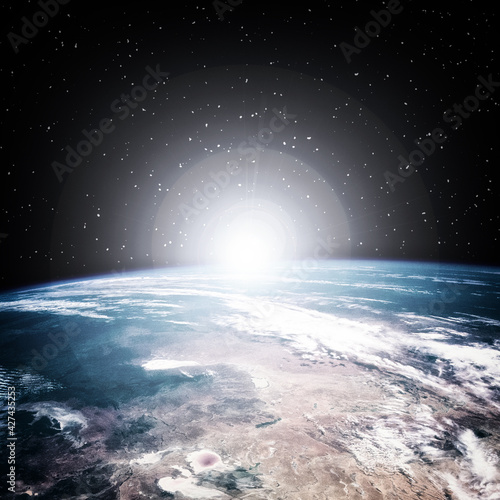 Fototapeta Naklejka Na Ścianę i Meble -  Earth from space during a sunrise. The elements of this image furnished by NASA.