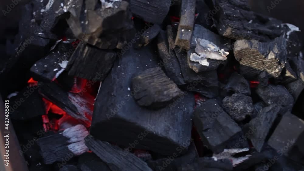 Coals burn in the grill. barbecue bonfire. Rest in nature, patio, screensaver background appeasement delighting flame fire Coals burn in the grill. barbecue bonfire. Rest in nature, patio, screensaver background appeasement delighting flame fire
