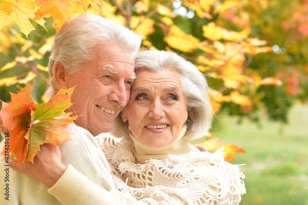 Happy senior woman and man in park Happy senior woman and man in park