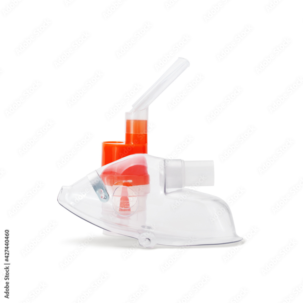 Respiratory mask and atomizing cup with nebulizer mouthpiece for compressor inhaler isolated on white background. Medical equipment for inhalation therapy for asthma and respiratory diseases. Respiratory mask and atomizing cup with nebulizer mouthpiece for compressor inhaler isolated on white background. Medical equipment for inhalation therapy for asthma and respiratory diseases.
