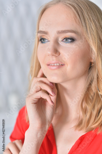 Portrait of beautiful young woman posing at home