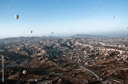 TURKEY, CAPPADOCIA, GOREME: Aerial scenic view of hot air balloons flying over valleys of Göreme National Park