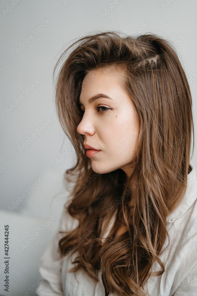 Close-Up Portrait Of Beautiful Young Woman With Healthy Clean Skin On A Face