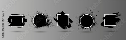 Black grunge splashes stencil with frame. Graffiti spray paint, different shapes. Dirty artistic design elements with frame for text. Grunge box with ink brush strokes and spray splash. Vector set
