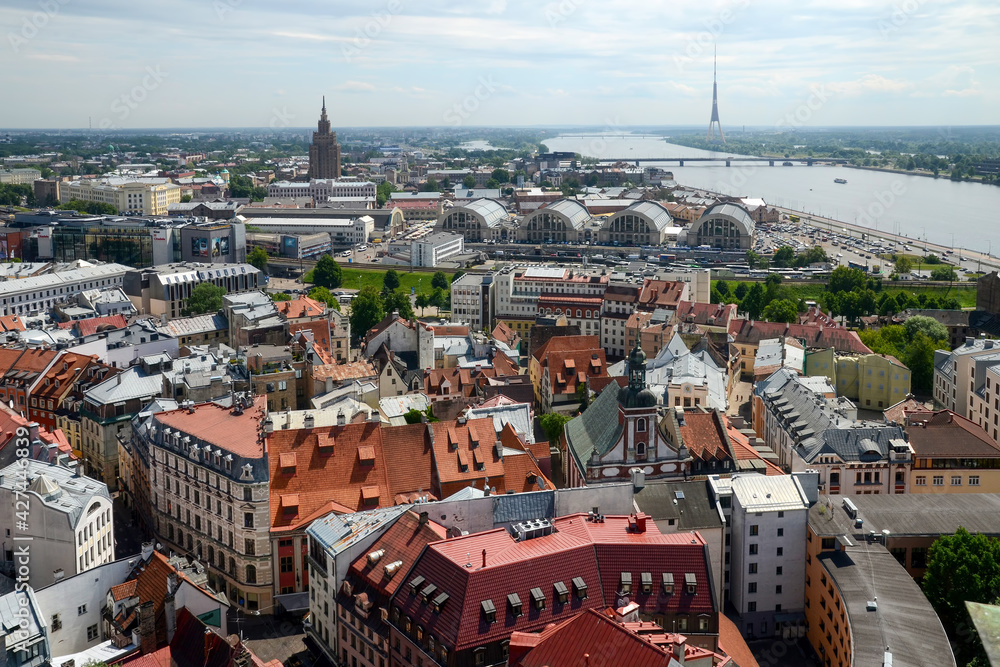 Aerial panoramic view of the city, Daugava river and TV tower. Riga, Latvia.