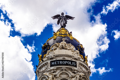 The dome of the Metropolis Building, an example of Romanesque, Beaux-Arts and Romanesque Revival architecture, at Calle de Alcala and Gran Via in Madrid, Spain. photo