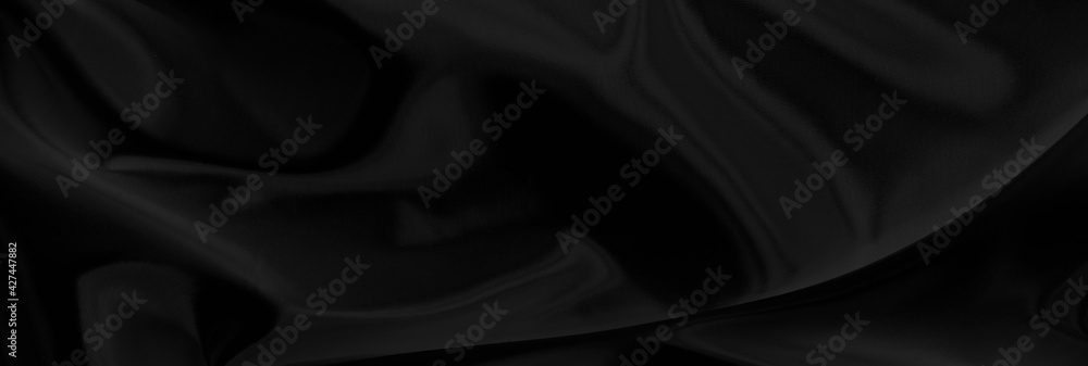 Obraz premium Black gray satin dark fabric texture luxurious shiny that is abstract silk cloth panorama background with patterns soft waves blur beautiful.