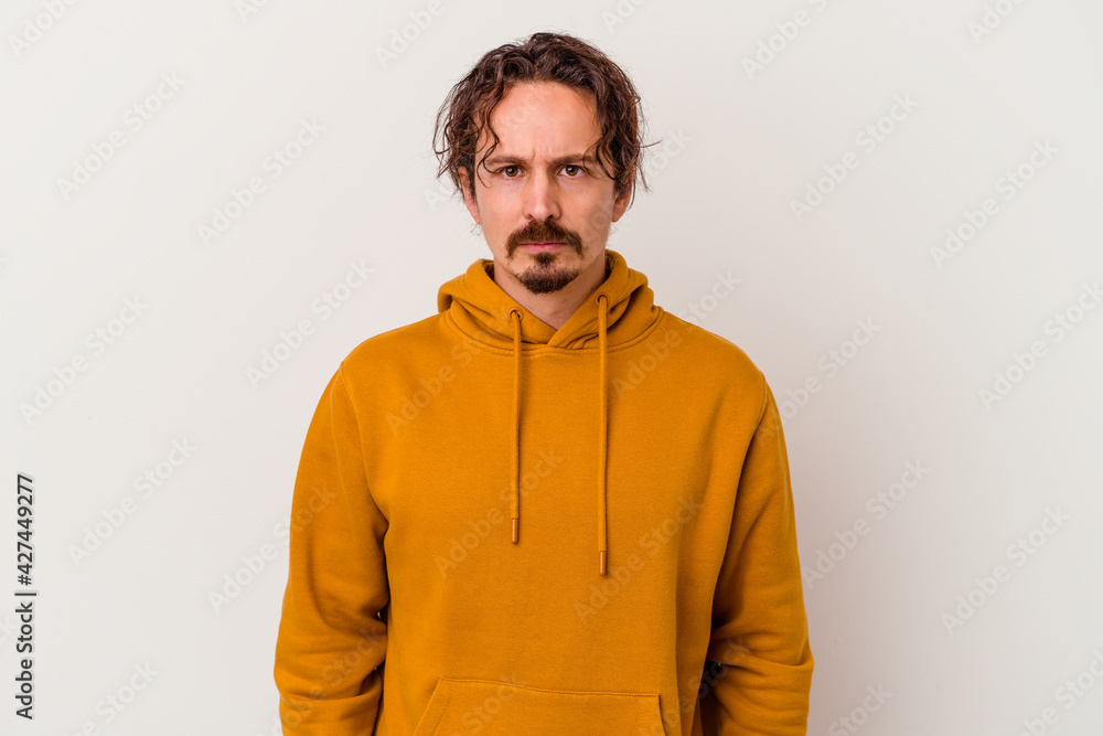 Young caucasian man isolated on white background sad, serious face, feeling miserable and displeased. Young caucasian man isolated on white background sad, serious face, feeling miserable and displeased.