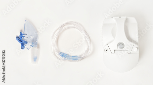 Inhaler compressor kit for inhalation and treatmenton white background, stock photo