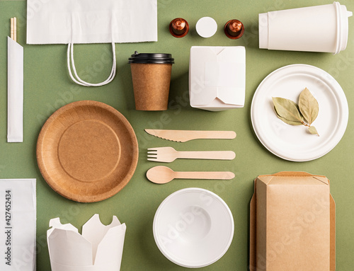 Fotografi Eco friendly disposable tableware on green background