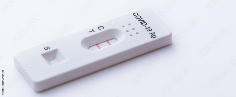 Rapid Covid-19 coronavirus strip test cassette for antibody or sars-cov-2 virus disease epidemic isolated on white background close-up Rapid Covid-19 coronavirus strip test cassette for antibody or sars-cov-2 virus disease epidemic isolated on white background close-up