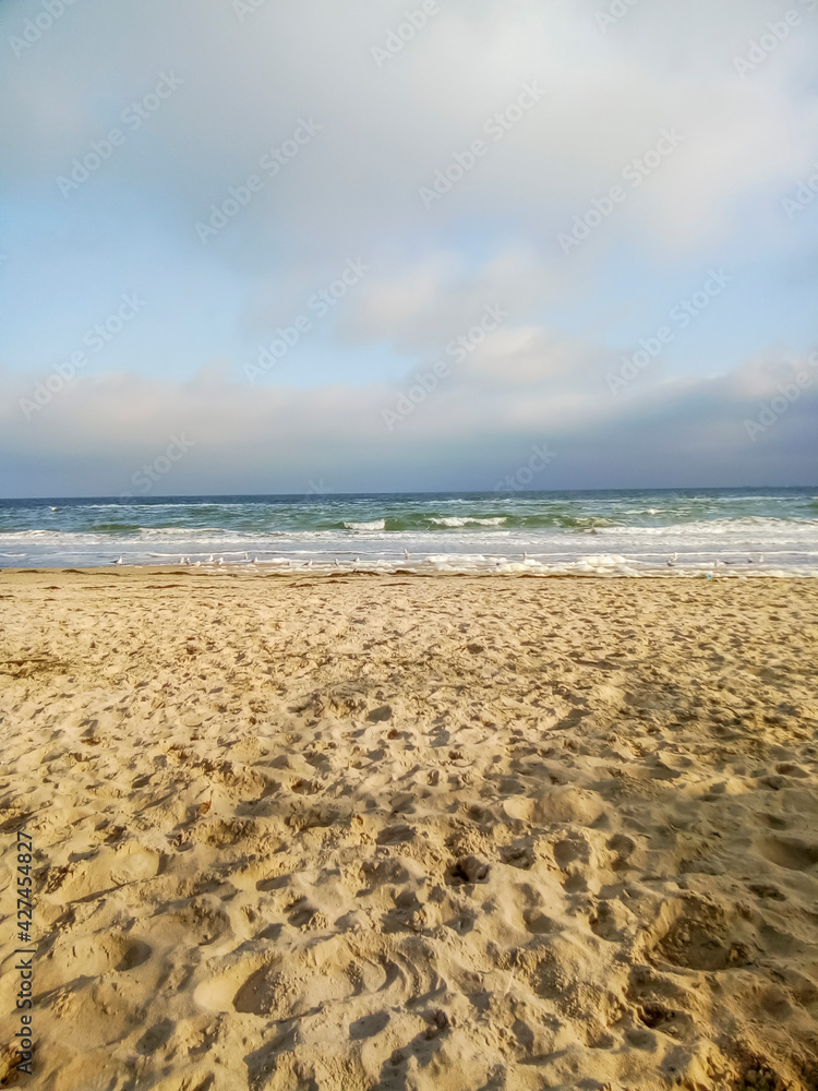 empty sand beach and sea in winter