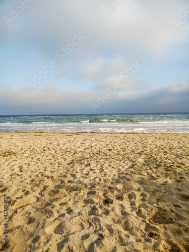 empty sand beach and sea in winter