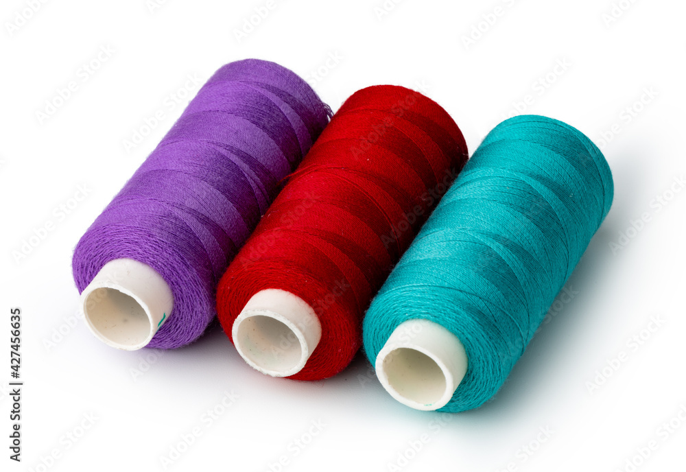 Color thread spool isolated on white background Color thread spool isolated on white background