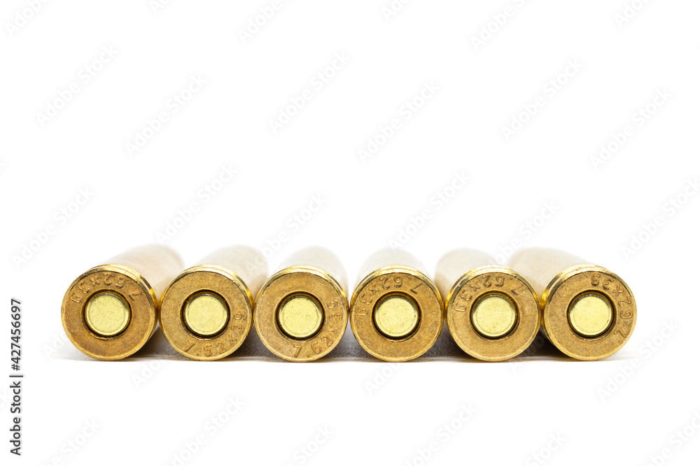 Bullets bottom isolated on white background. Cartridges 7.62 caliber for Kalashnikov assault rifle closeup Bullets bottom isolated on white background. Cartridges 7.62 caliber for Kalashnikov assault rifle closeup