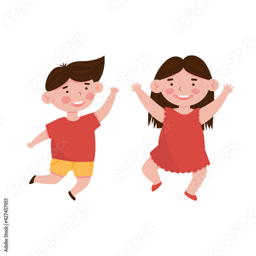 Happy smiling boy and girl in red dress jumping. Cartoon vector illustration, isolated on a white