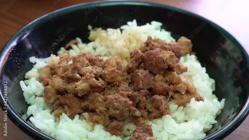 Braised meat over cooked rice, famous and delicious street food in Taiwan. Braised meat over cooked rice, famous and delicious street food in Taiwan.