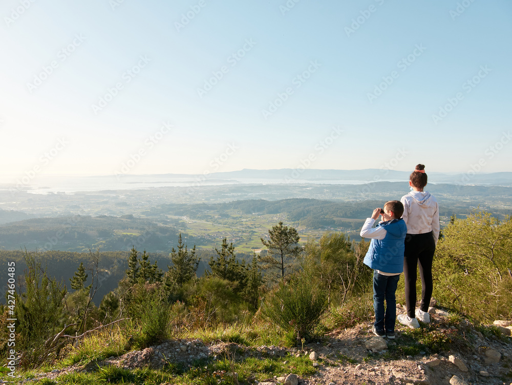 Boy and girl looking at the landscape