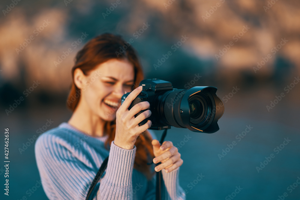 woman tourist with camera in nature Travel professional