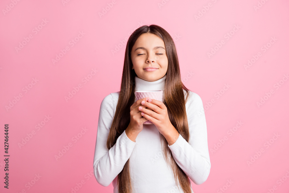 Photo of dreamy charming schoolgirl dressed white sweater enjoying beverage aroma isolated pink color background Photo of dreamy charming schoolgirl dressed white sweater enjoying beverage aroma isolated pink color background